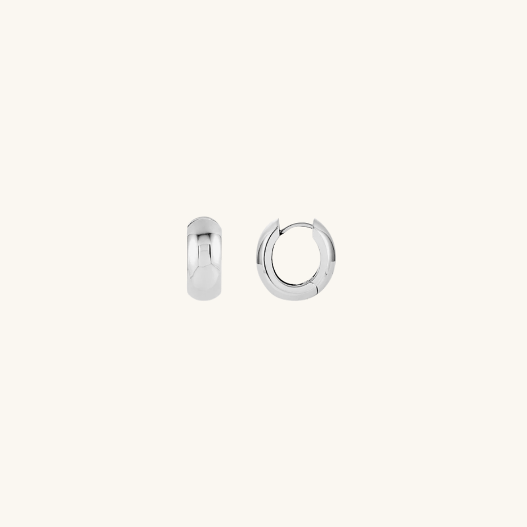 Pair of silver hoop earrings on a white background