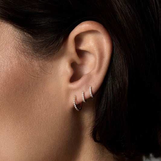 silver huggie hoops encrusted with cz to add sparkle 